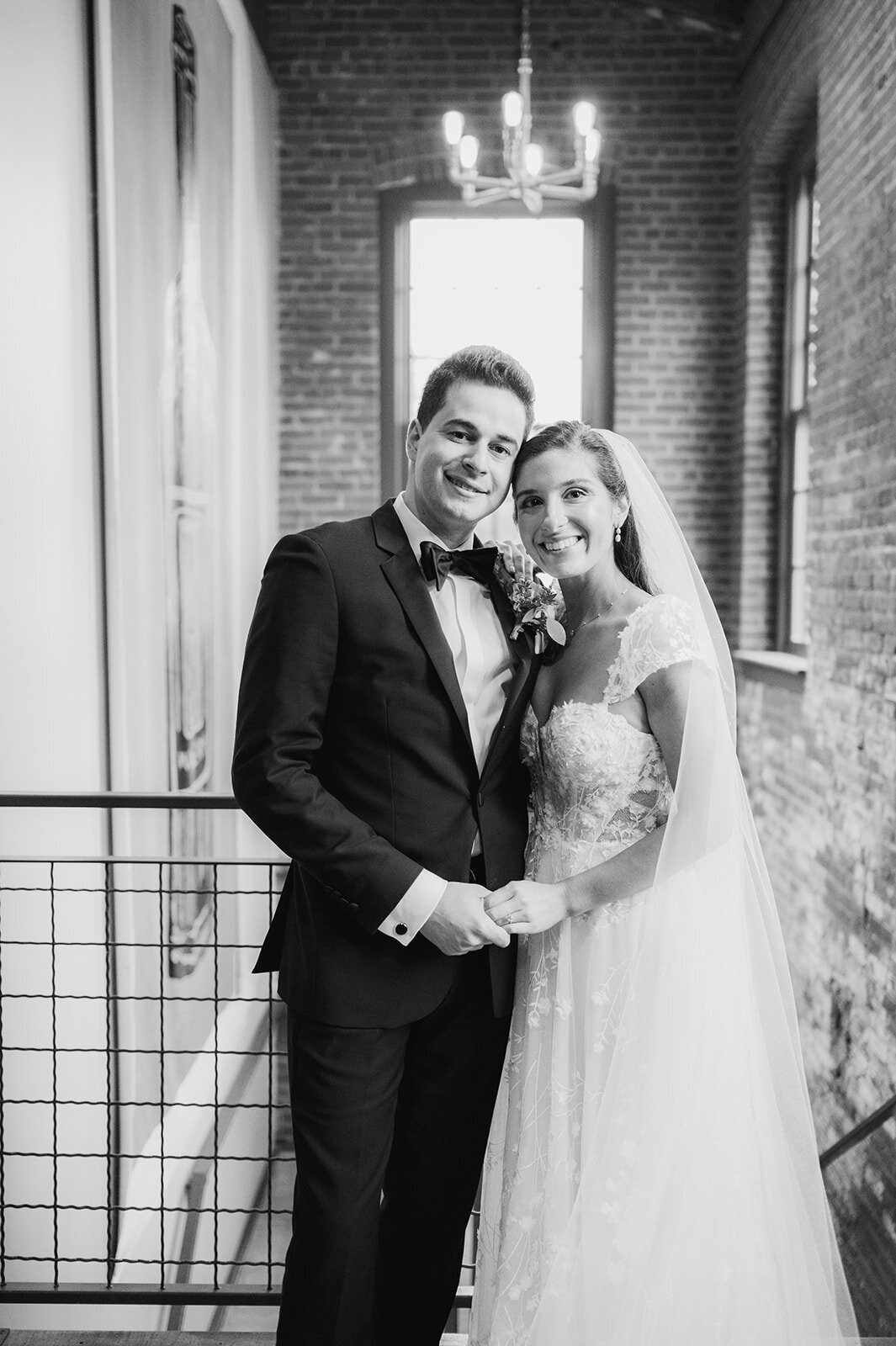 bride and groom share formal moment during portraits