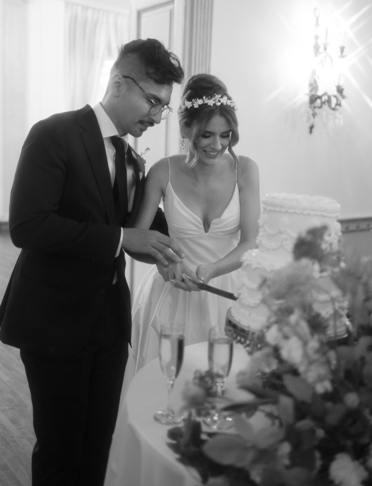 A newlywed couple cuts vintage wedding cake at The Colony Club, Detroit
