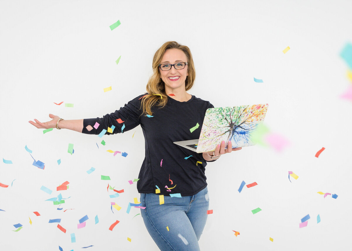 Melissa Villamaino, founder of Manifest Web Design Studio celebrating branding and website launch