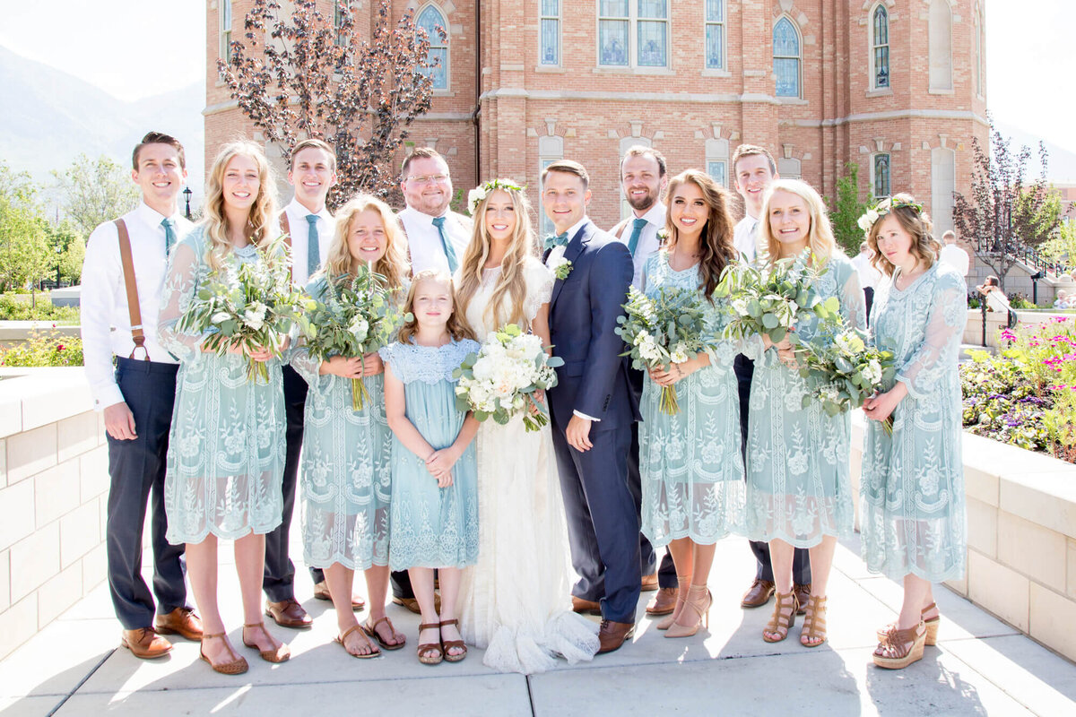 bridal party in mint and blue ona bright wedding day