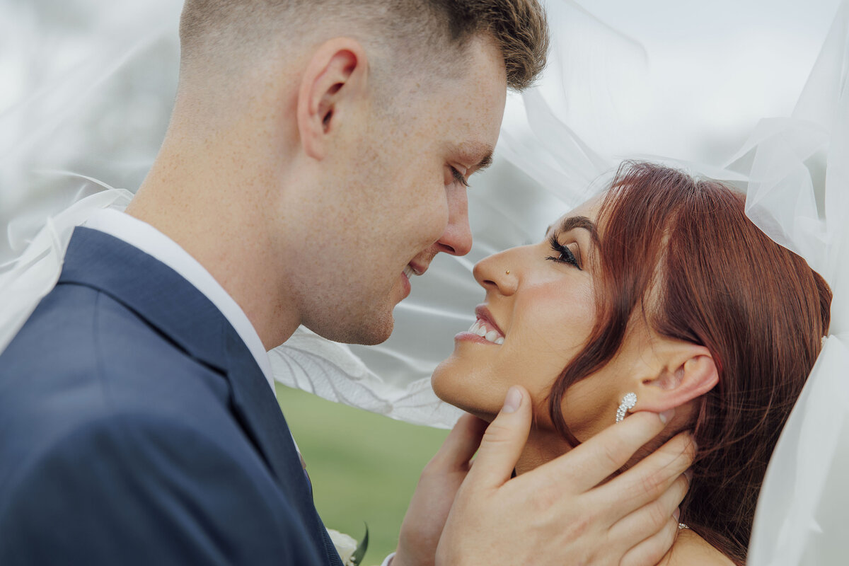 Eagle Oaks Golf Club | Bride and groom under veil close-up during summer wedding | Farmingdale, New Jersey
