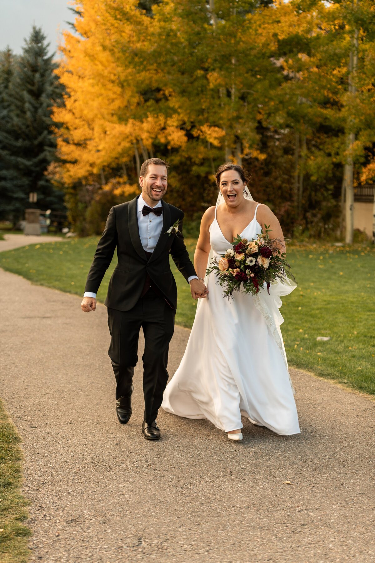 Bride and groom excited after their wedding ceremony on their wedding day.