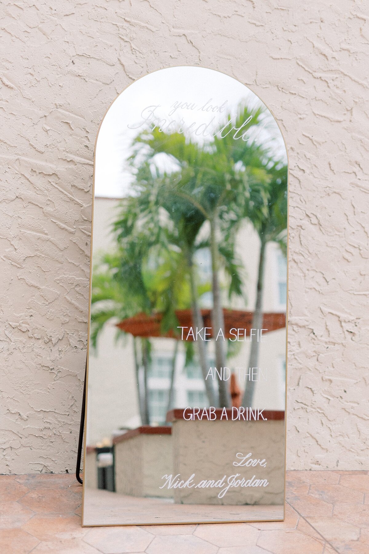 Large gold arch mirror with calligraphy for selfie sign