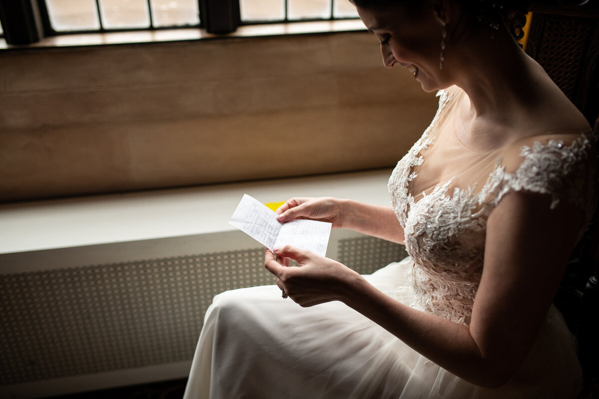 Bride reads a note from the groom before the ceremony