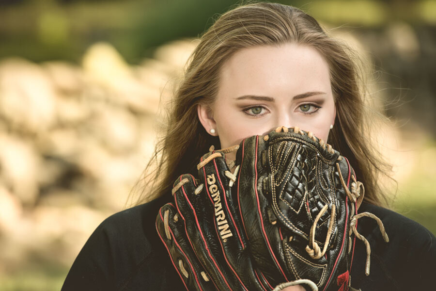 girl behind softball glove