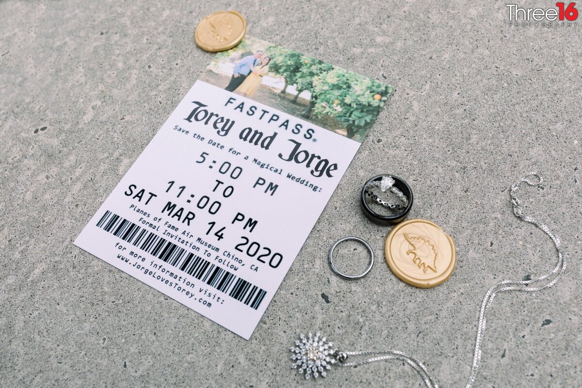 A wedding invitation appears as a ticket stub along with trinkets