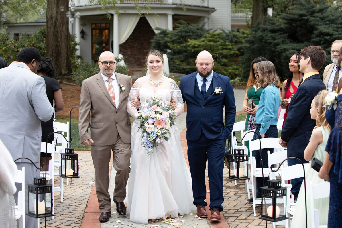 Atlanta-Wedding-Photographer-Carl-House-Bride-Walking-Down-Aisle-With-Family