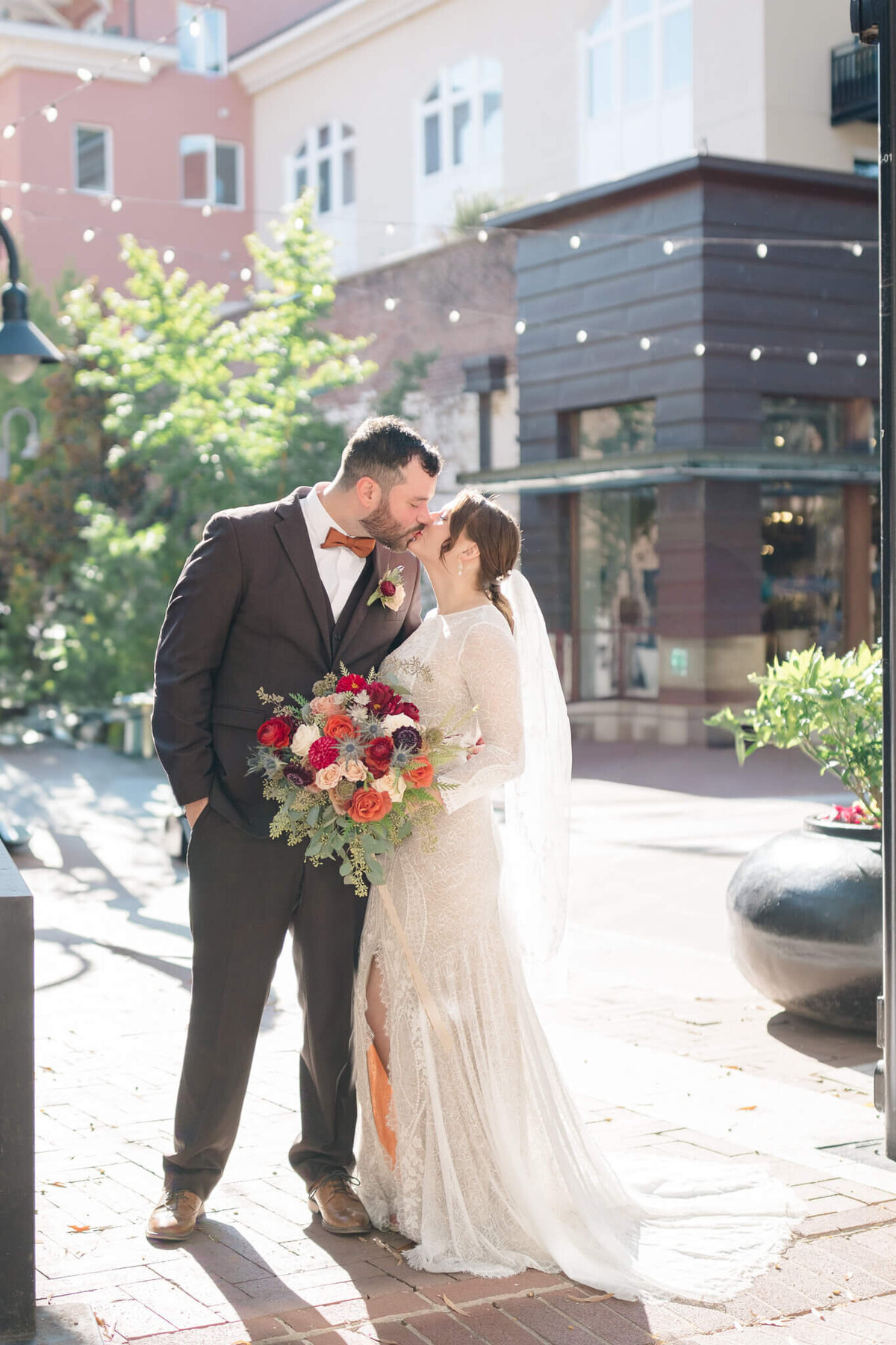 Bride and Groom kissing at The Mall in Charlottesville, Virginia.