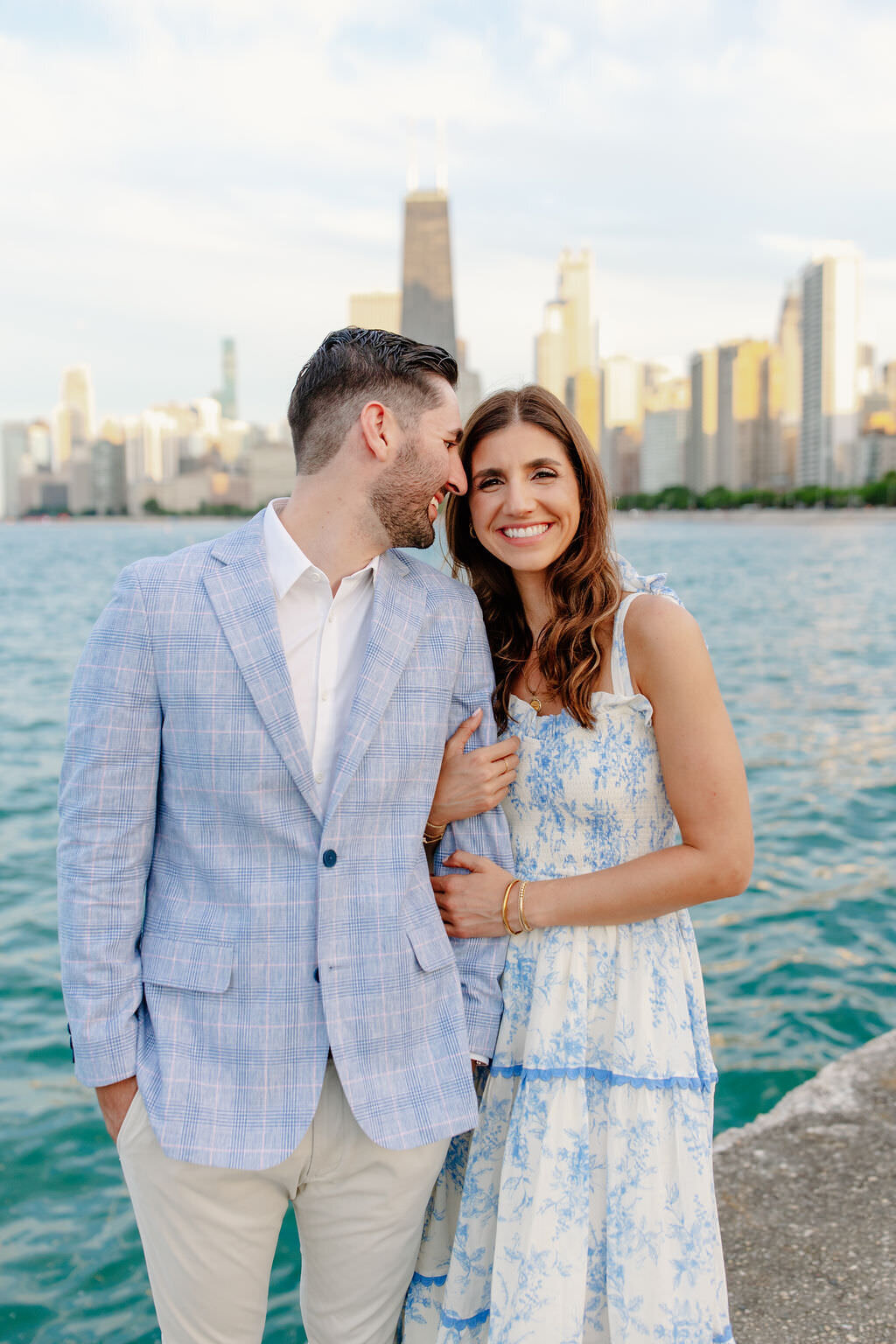 An engagement photography session at The Wrigley Building and North Ave Beach in Chicago, Illinois - 25