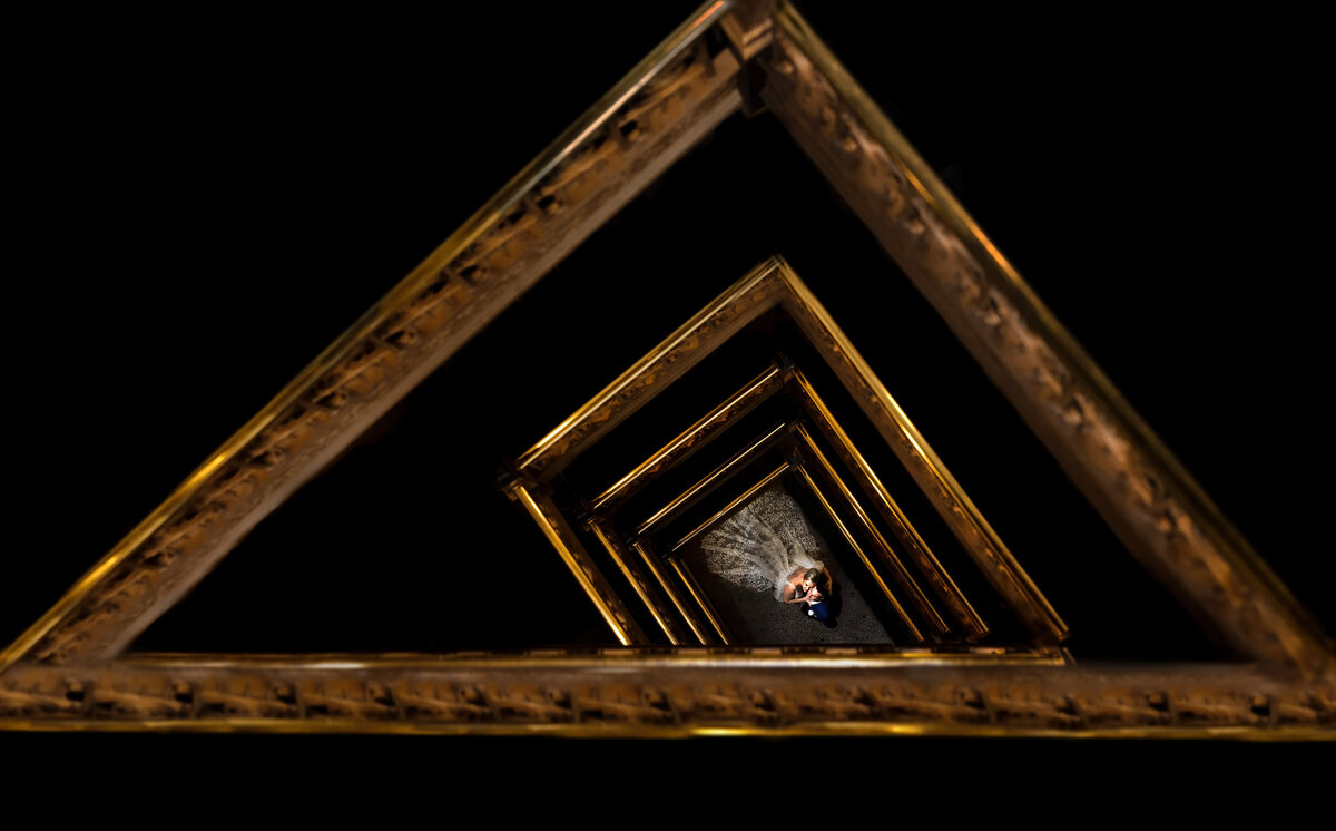 A couple is seen at the bottom of a staircase at the Hyatt Arcade.