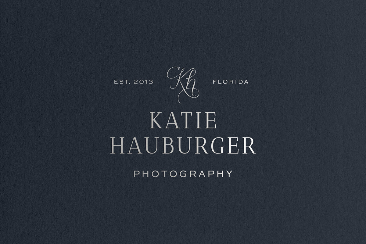 a mockup of a photographer logo with a script monogram