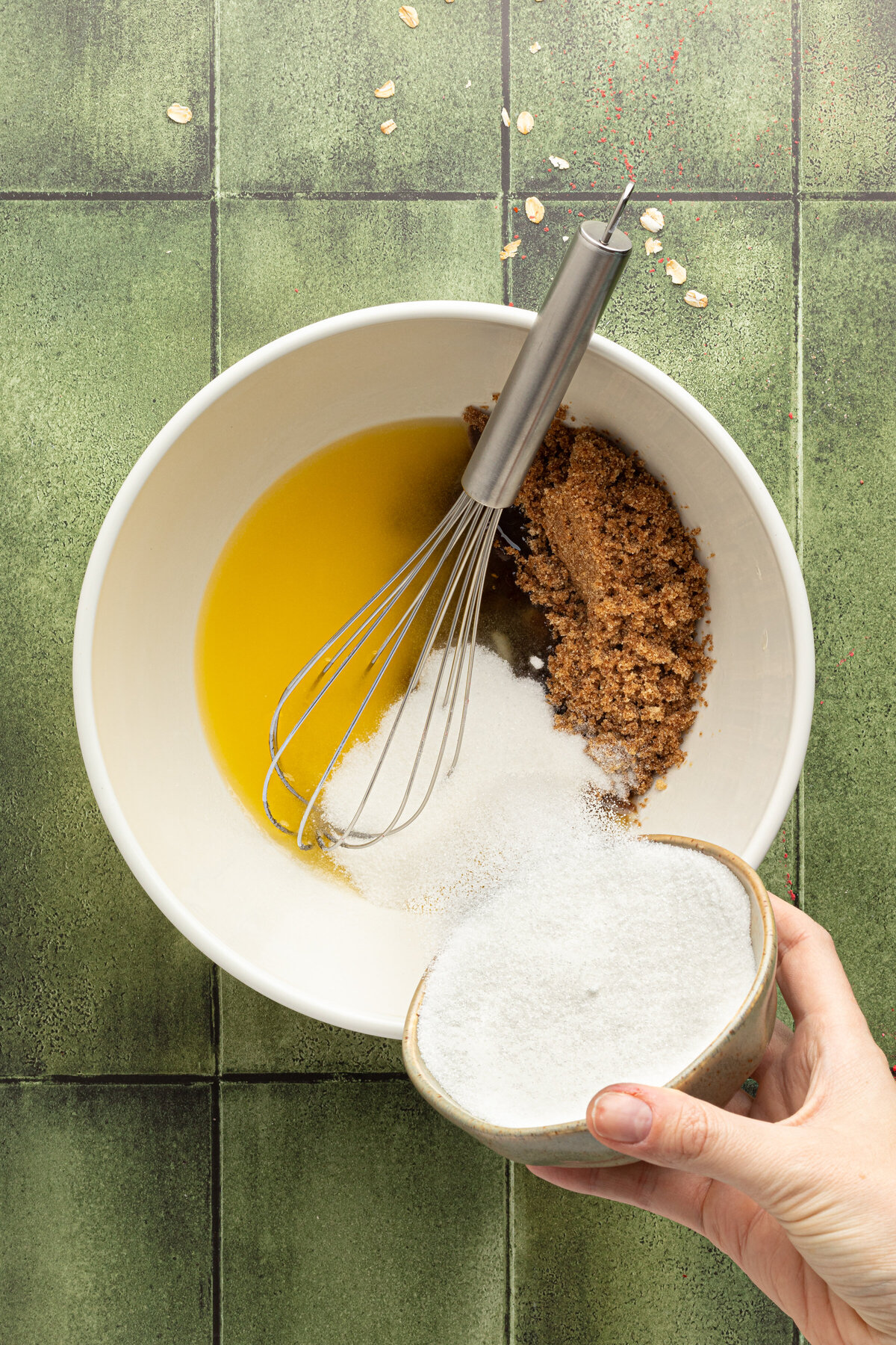 butter and sugar in a mixing bowl with a whisk