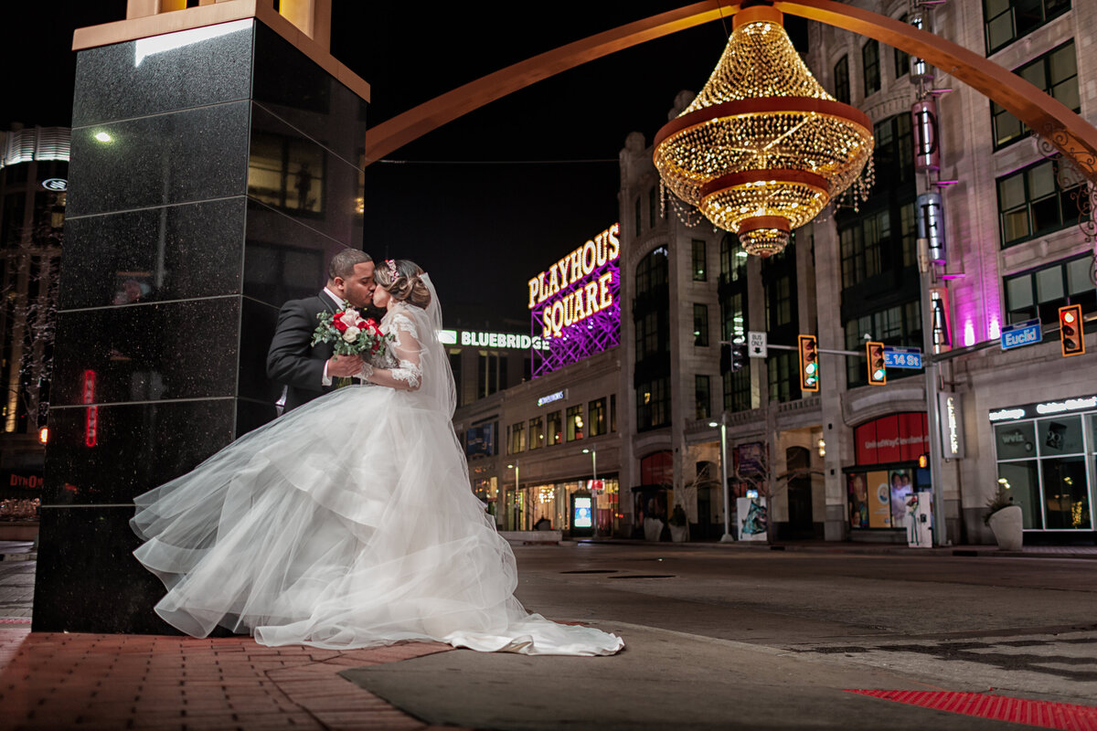 bride and groom kissing Playhouse square under the chandelier Cleveland wedding photographer photography