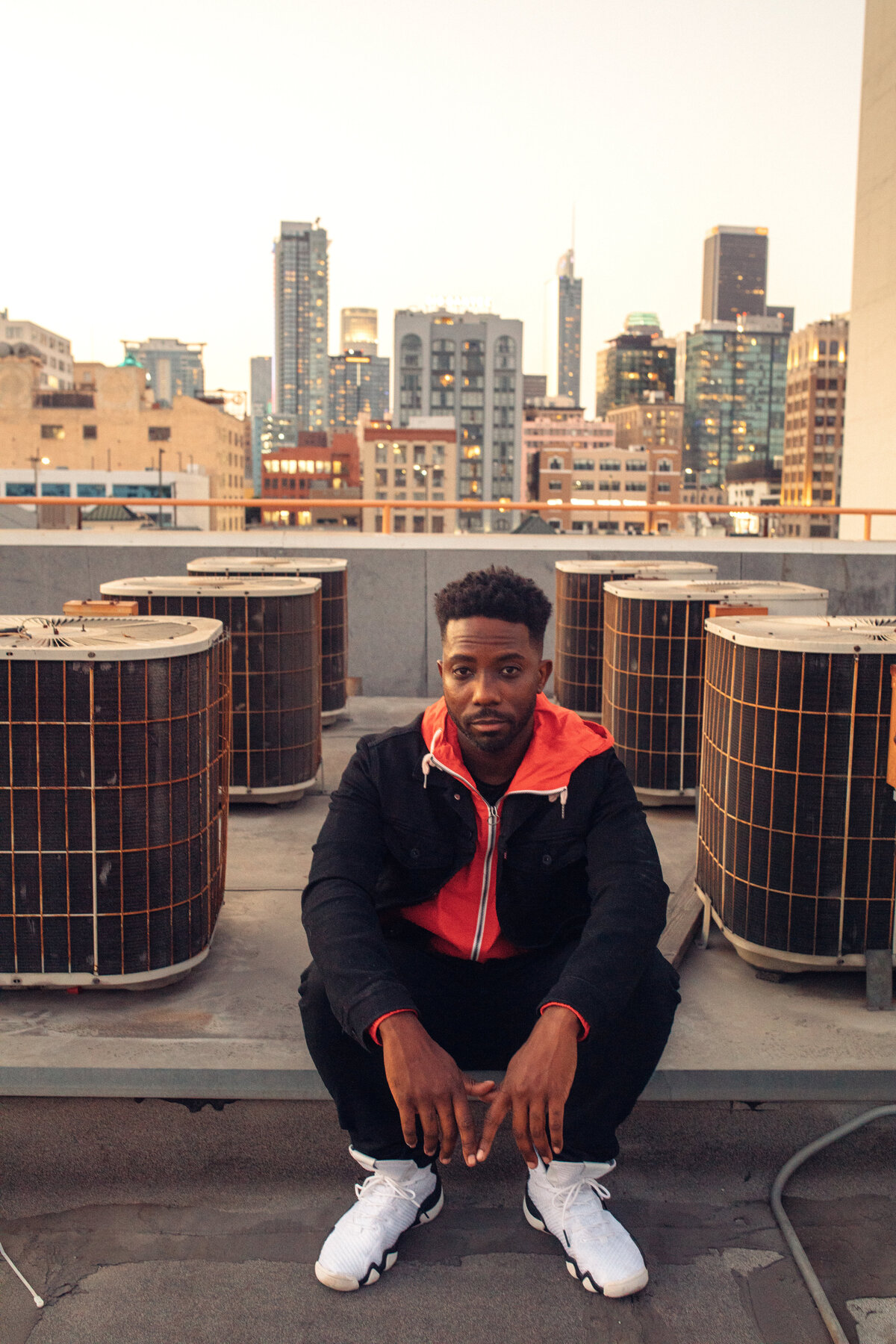 Portrait Photo Of Young Black Man Sitting On The Rooftop Los Angeles