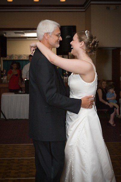 A picture of me at my wedding dancing with my dad.