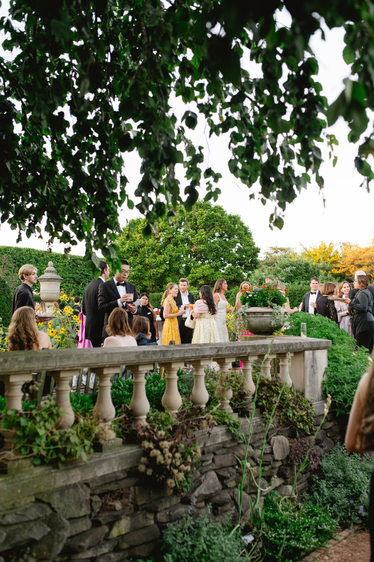 Guests enjoying a ceremony along a lush pathway at the Chicago Botanic Gardens