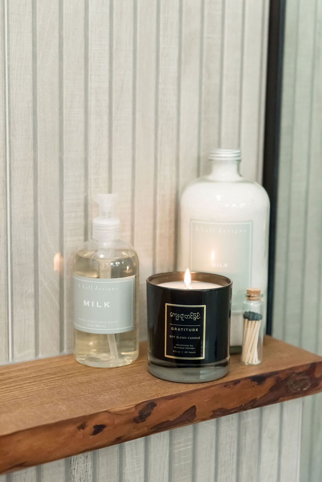 dewine design interiors hotel lux bathroom candle on wooden shelf