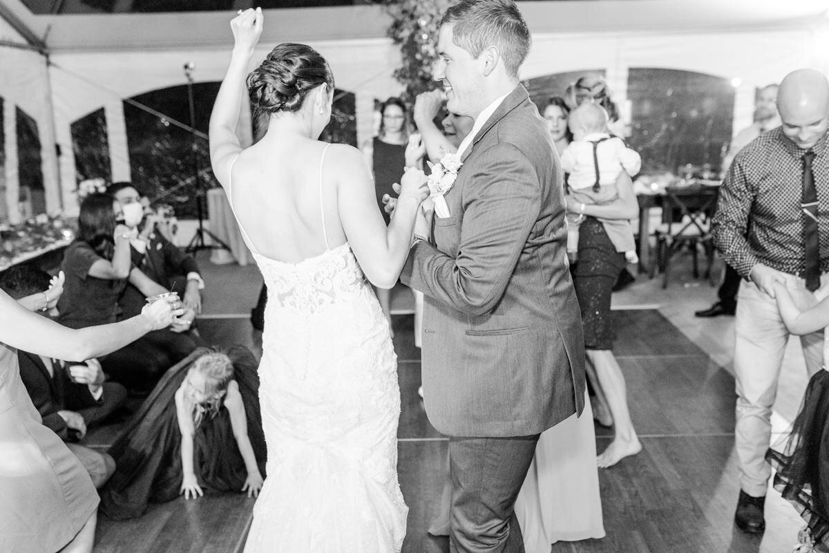 black and white photo of bride and groom on dance floor