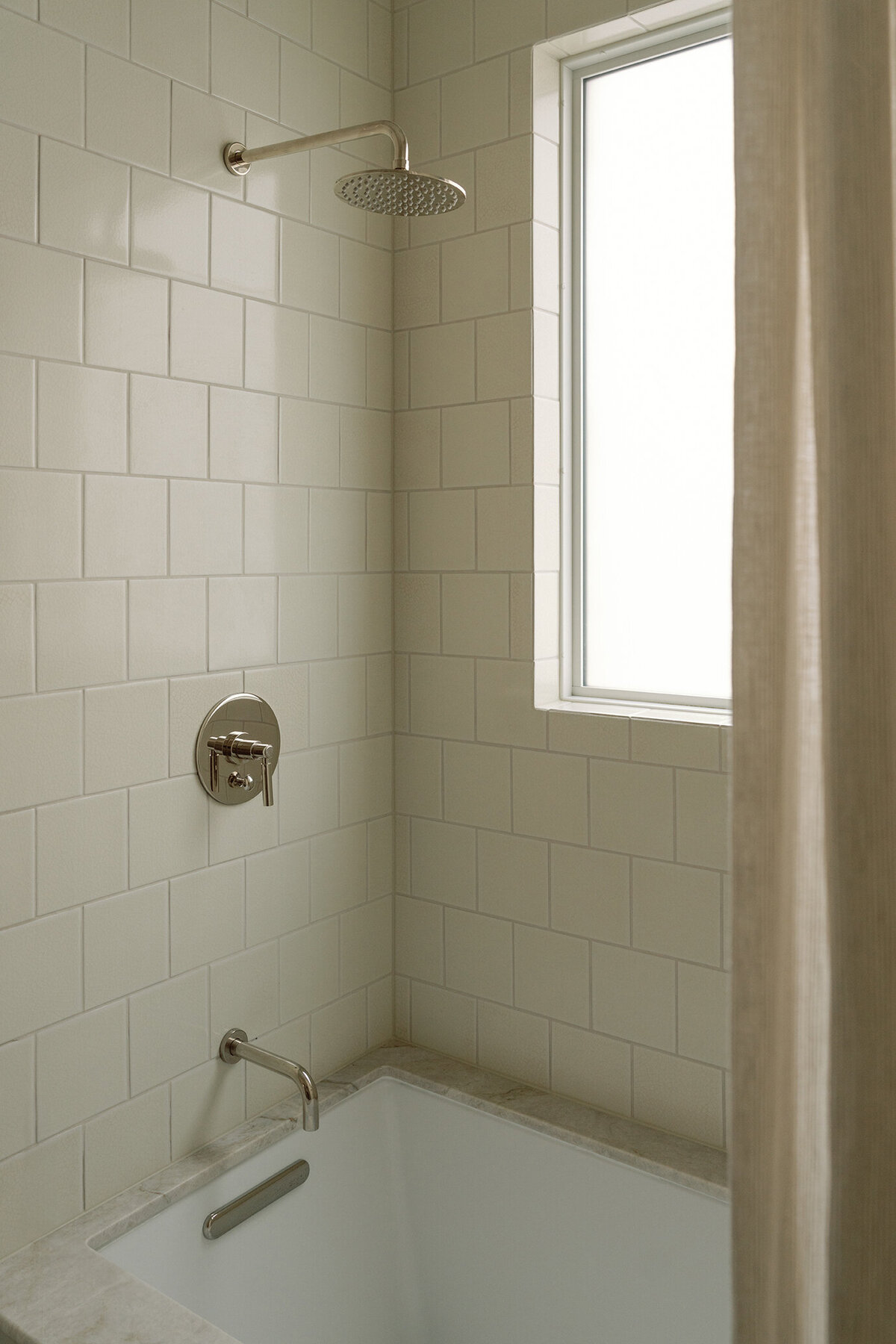 House-Franc-historical-bathroom-remodel-renovation-stripe-curtain-taj-mahal-quartzite-countertops-nickel-bell-flowers-fireclay-crackle-tile-traditional-modern-bathroom-phylrich-warm-cozy-austin-texas
