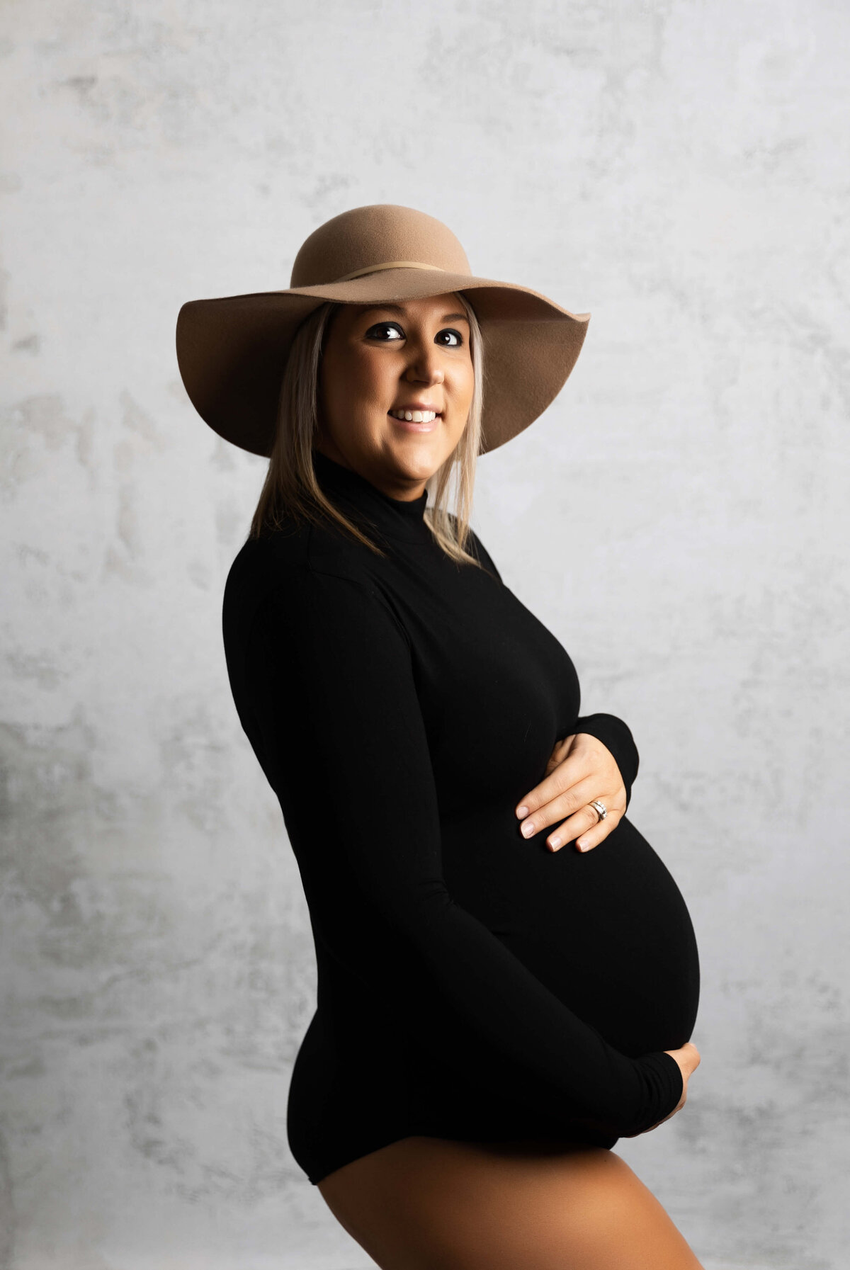 Photo of a pregnant mom posing for maternity portraits in an Erie PA studio