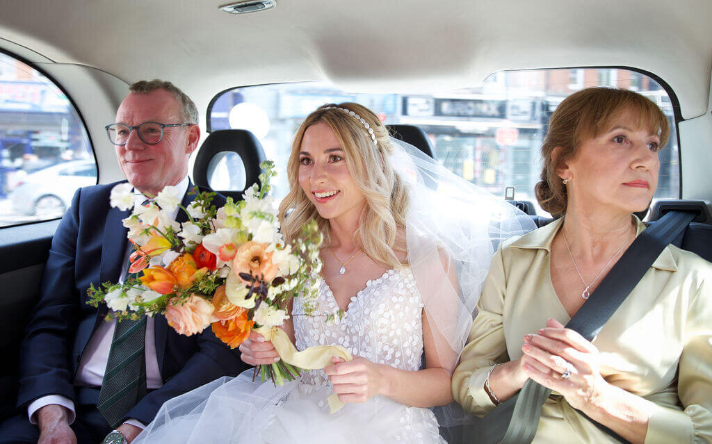 Bride and parenst travelling to Hackney Town Hall