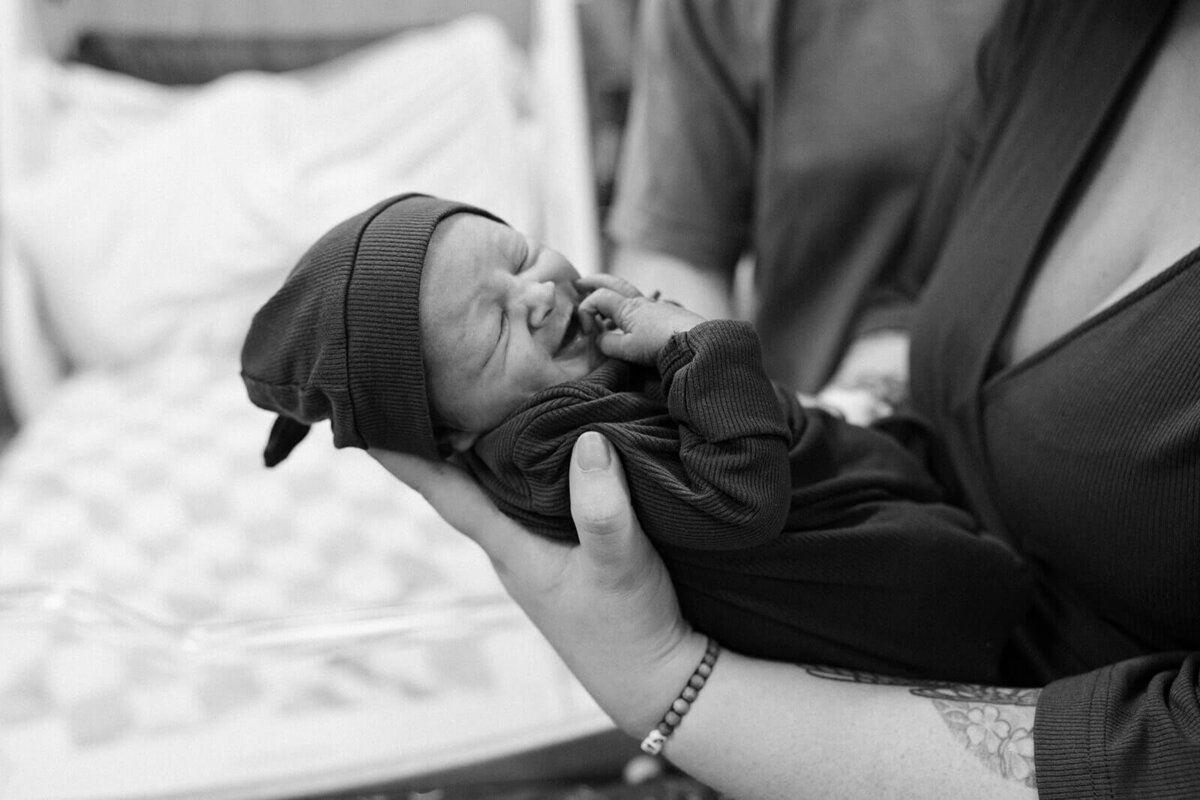 Parents holding a newborn baby