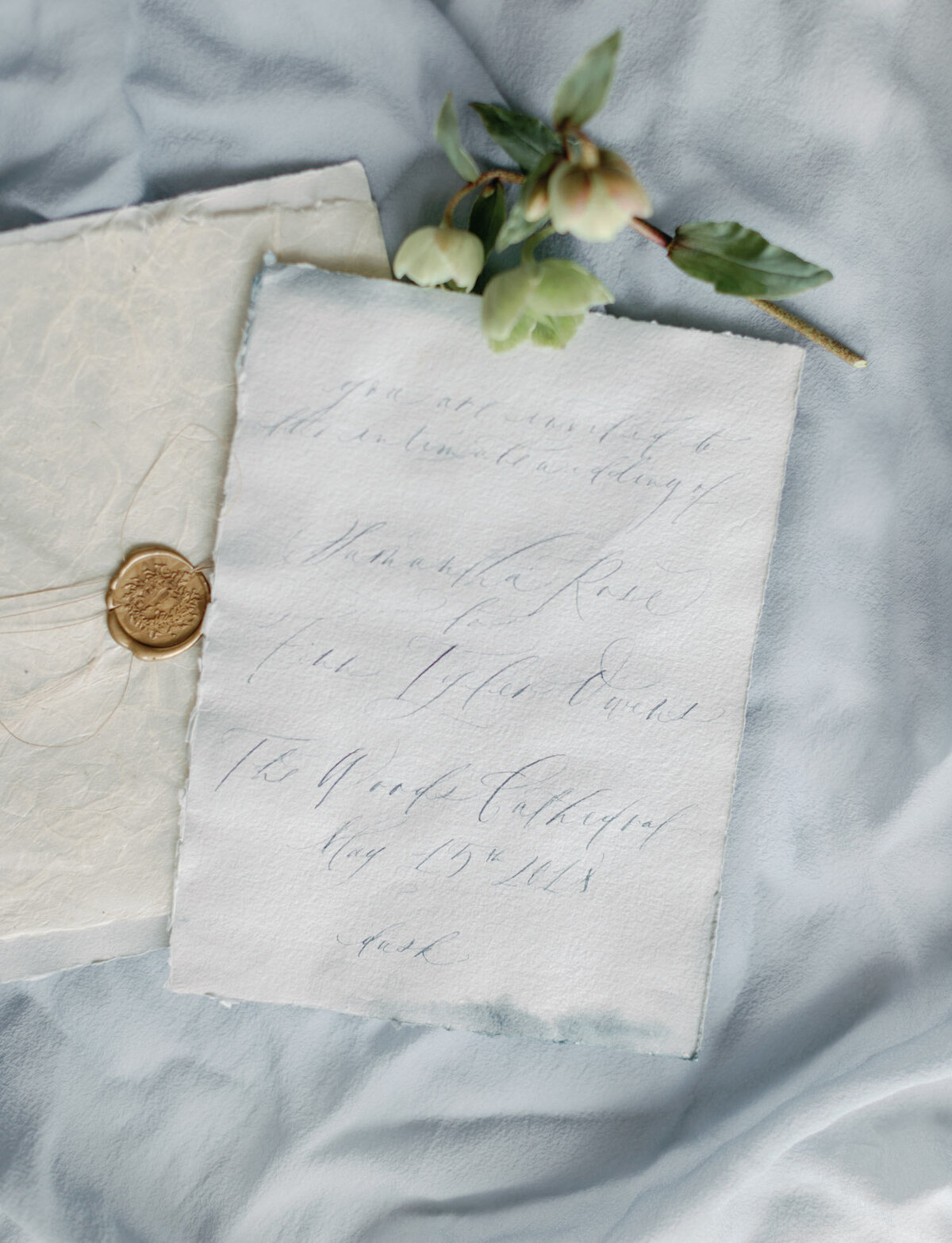 soft handmade paper calligraphy wedding invitation with gold wax seal