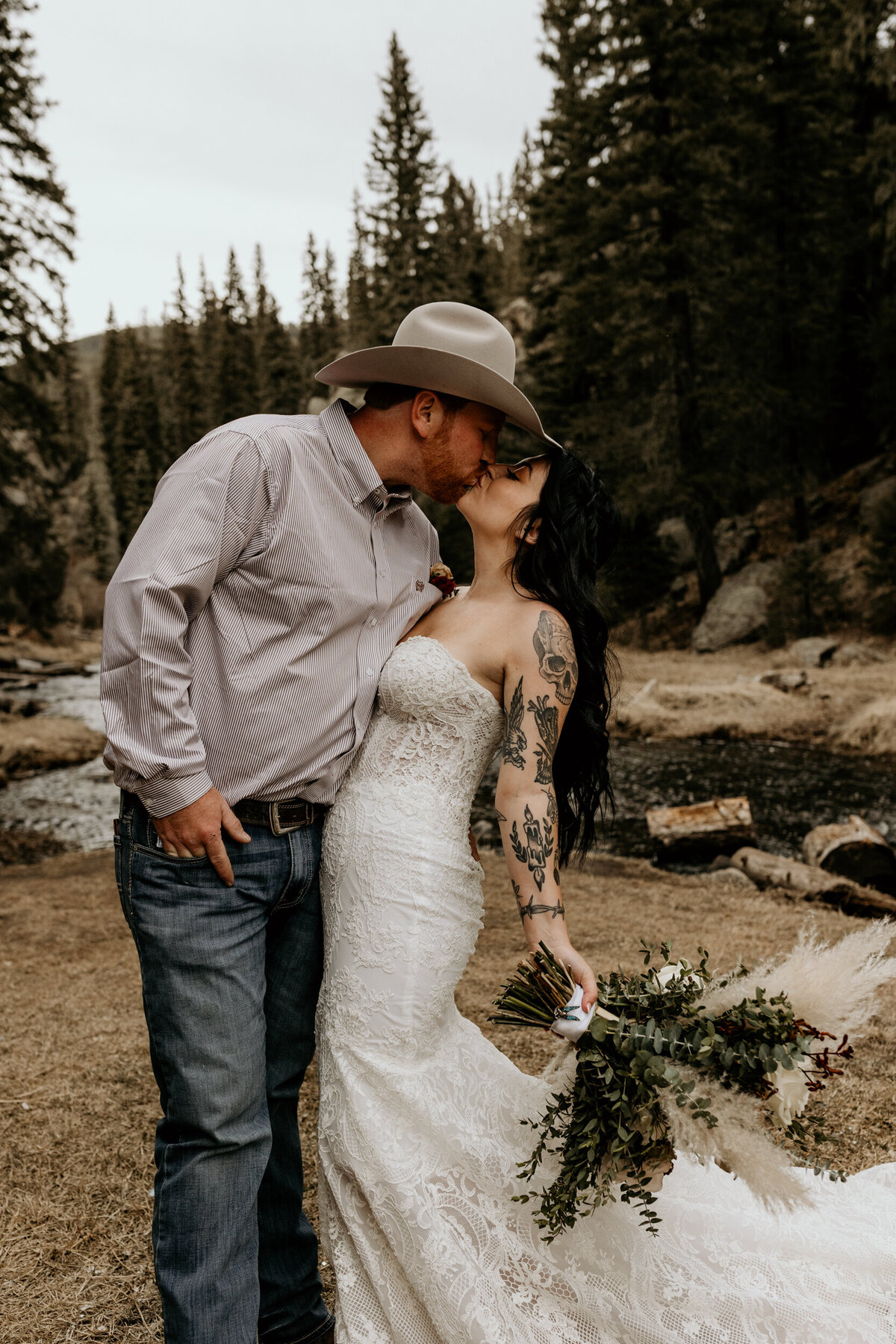 cowboy groom kissing new bride in New Mexico