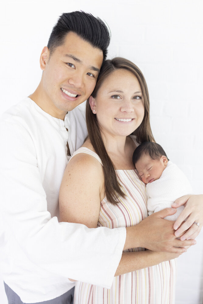 Connecticut newborn photography of parents with baby boy