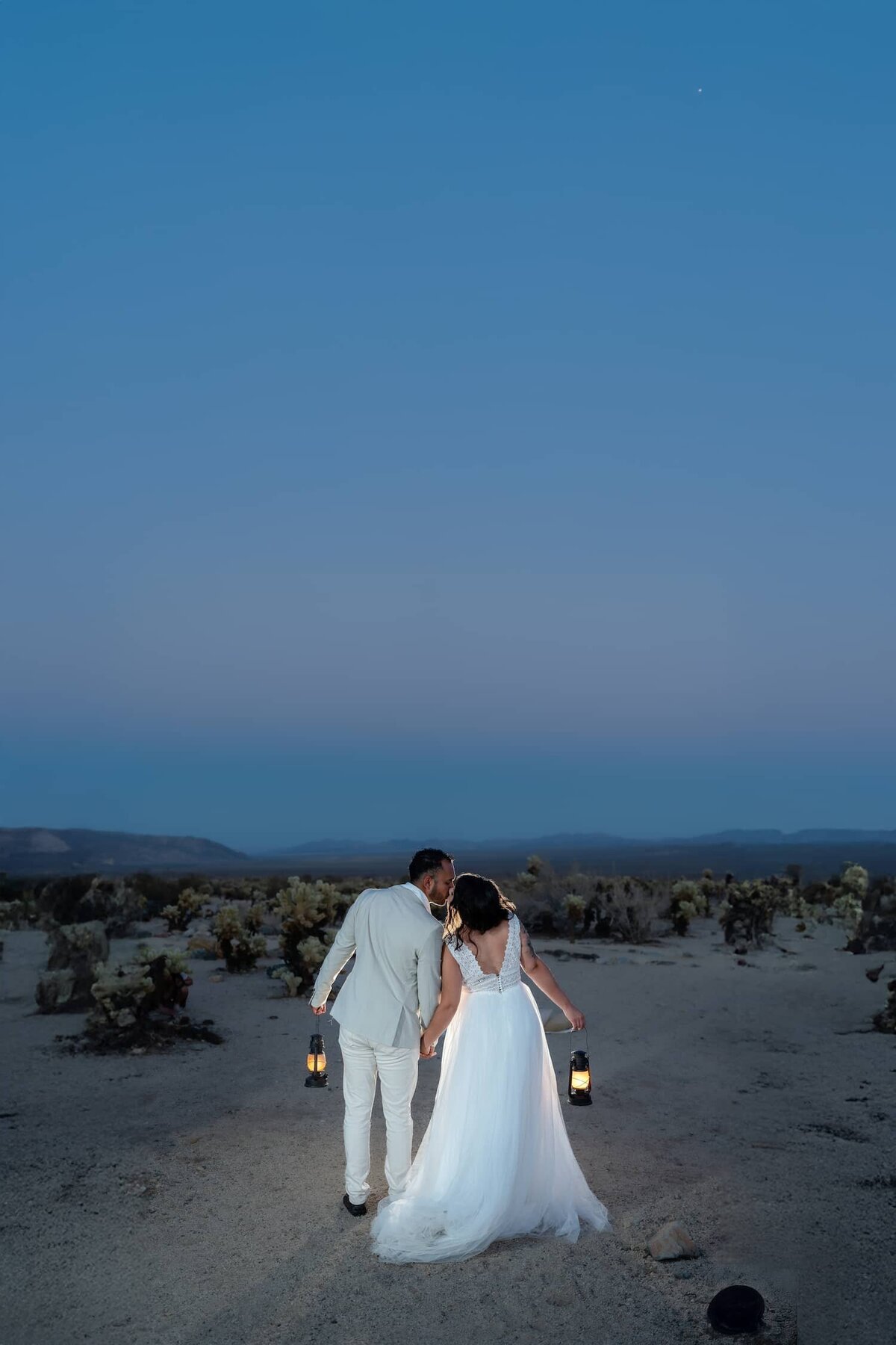 Joshua Tree Elopement Bride and Groom during a vibrant Blue Hour night with Lanterns