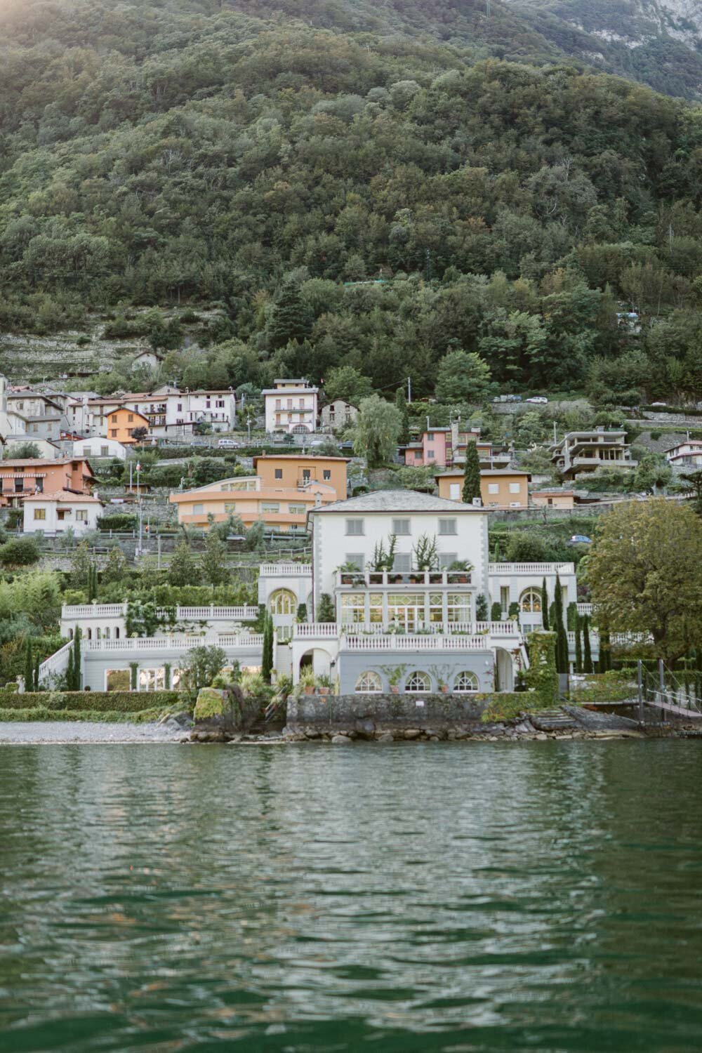 lake como views from a boat ride with bride and groom