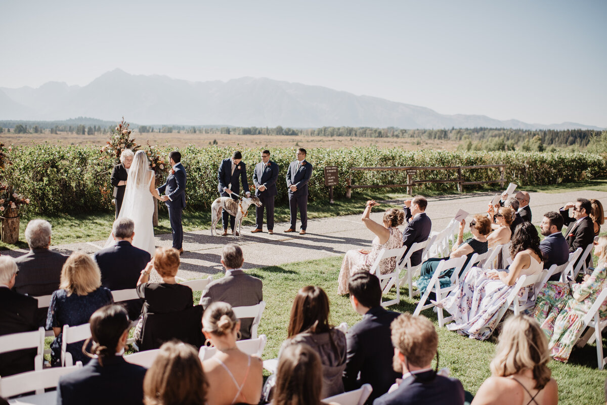Photographers Jackson Hole capture couple getting married at wedding ceremony