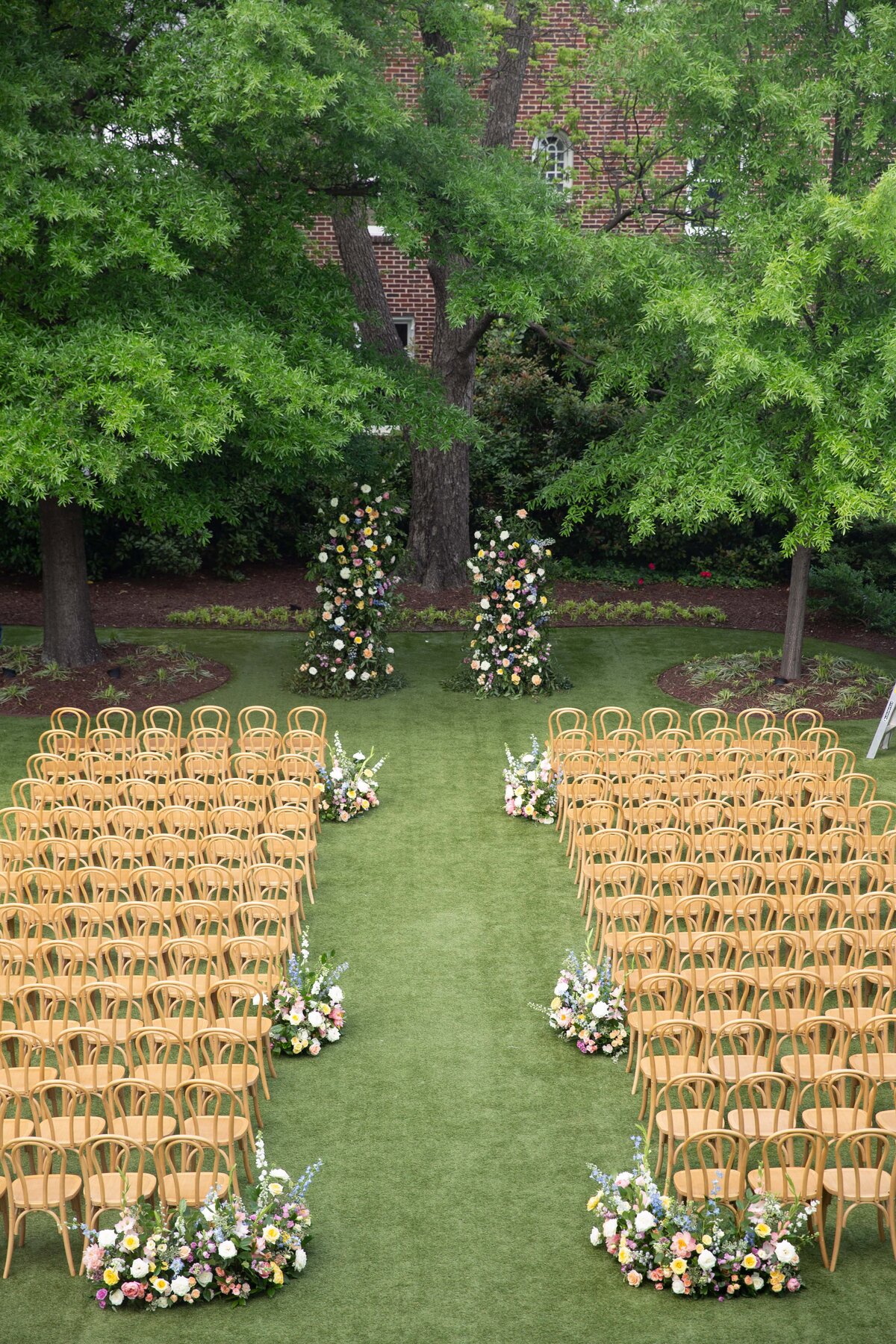 Aerial view of the wedding ceremony setup on the lawn of Merrimon-Wynne House in Spring.