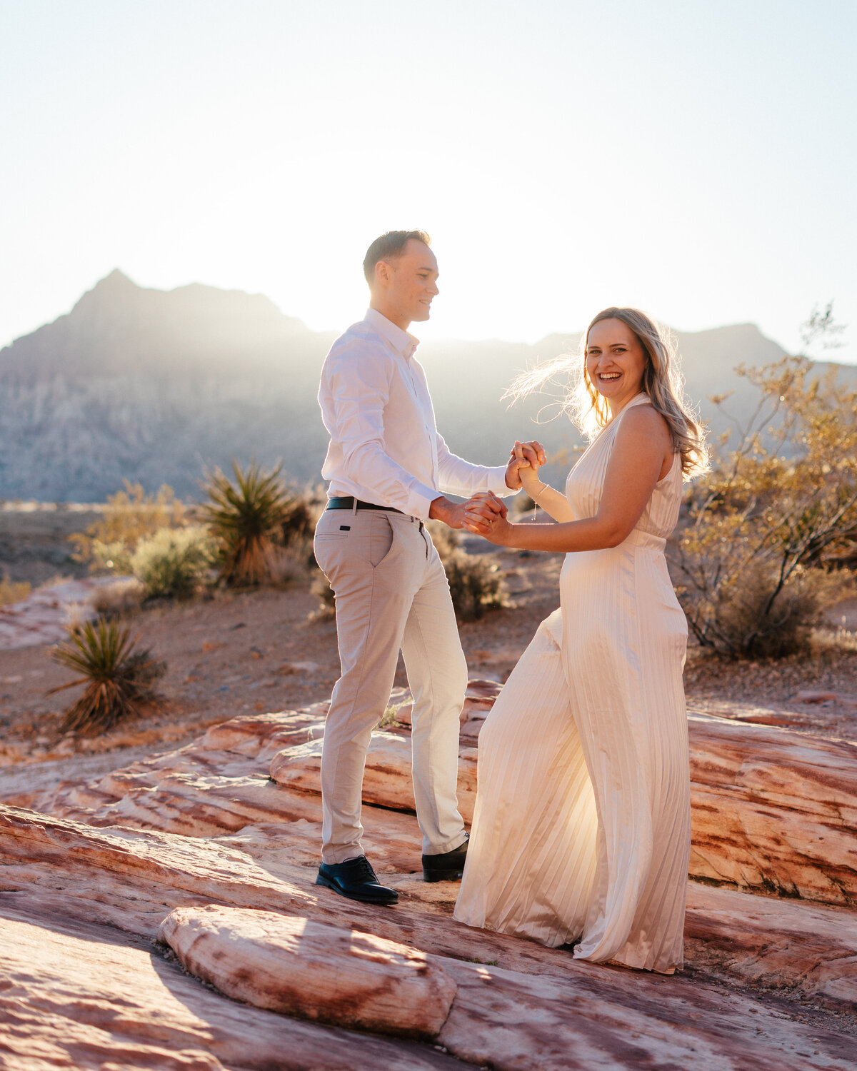 couple dancing at golden hour in the nevada desert