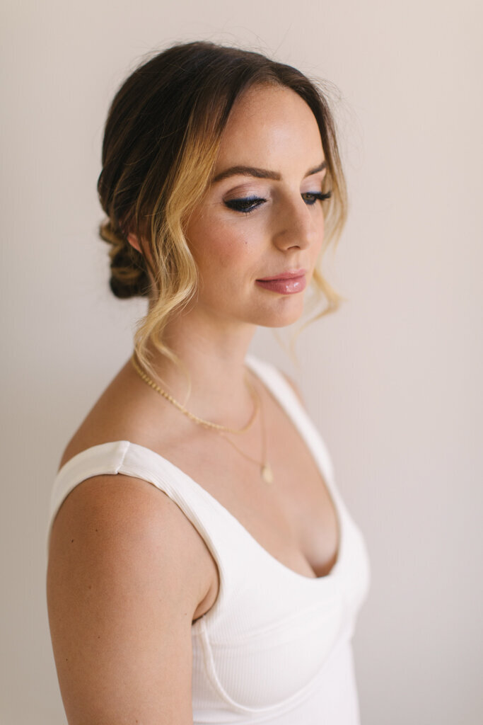 Romantic and elegant bridal hairstyle by Veil Beauty Co, Edmonton hair & makeup artist, featured on the Brontë Bride Vendor Guide.