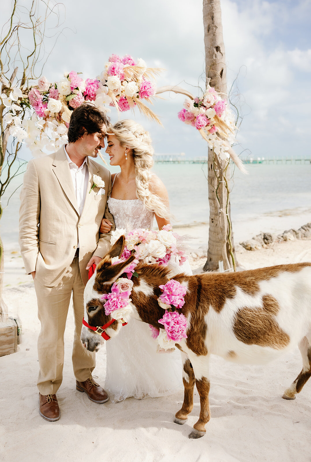 Brenda & Stephen’s playful wedding moment with a decorated donkey at Cheeca Lodge.