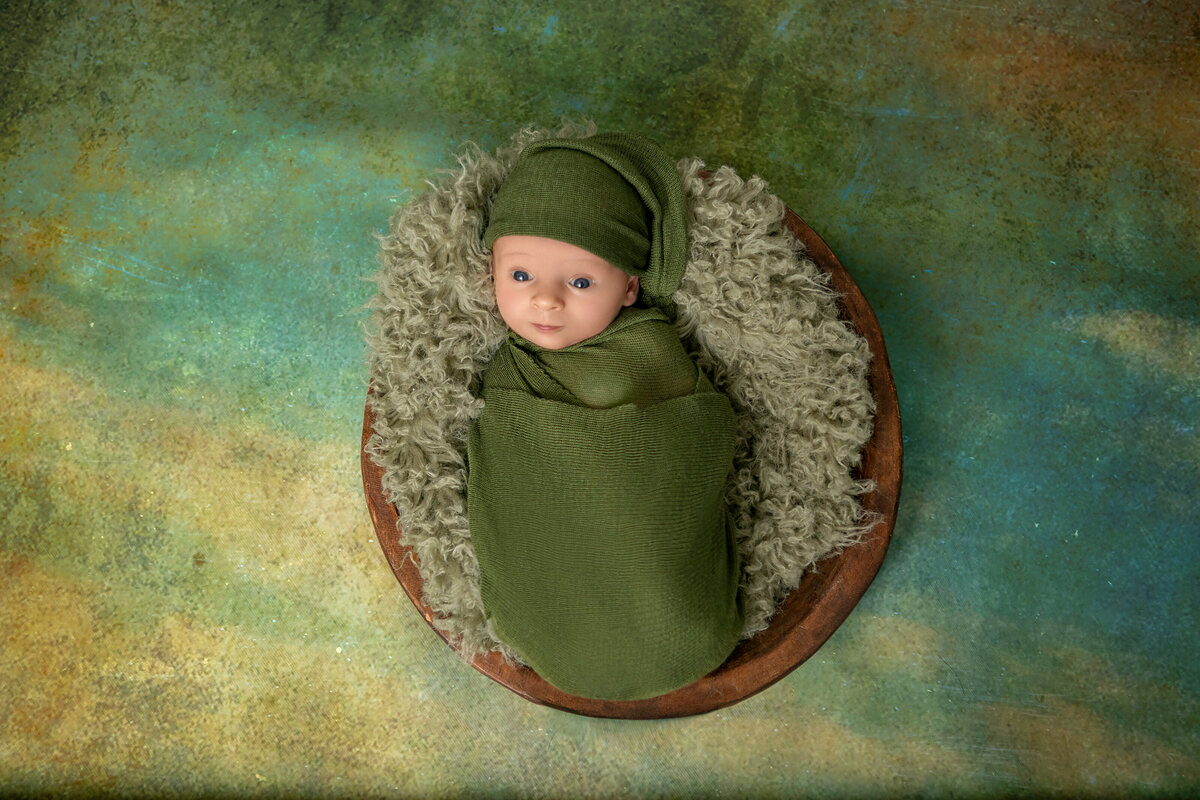 Baby boy in green wrap