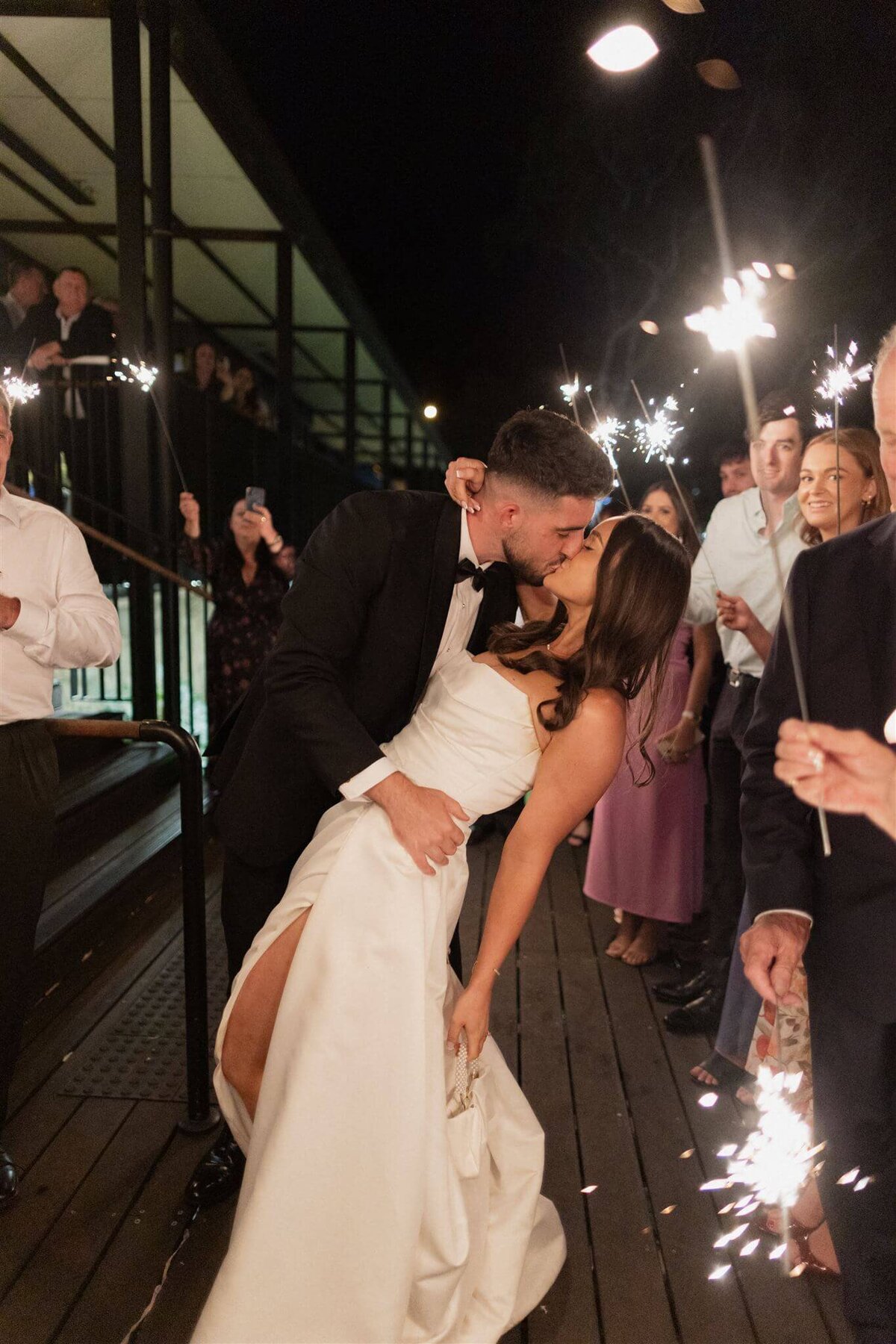 Couple during their sparkler exit on their wedding day 