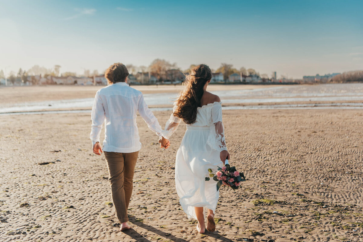 Wollaston Beach Elopement - sunset hand in hand