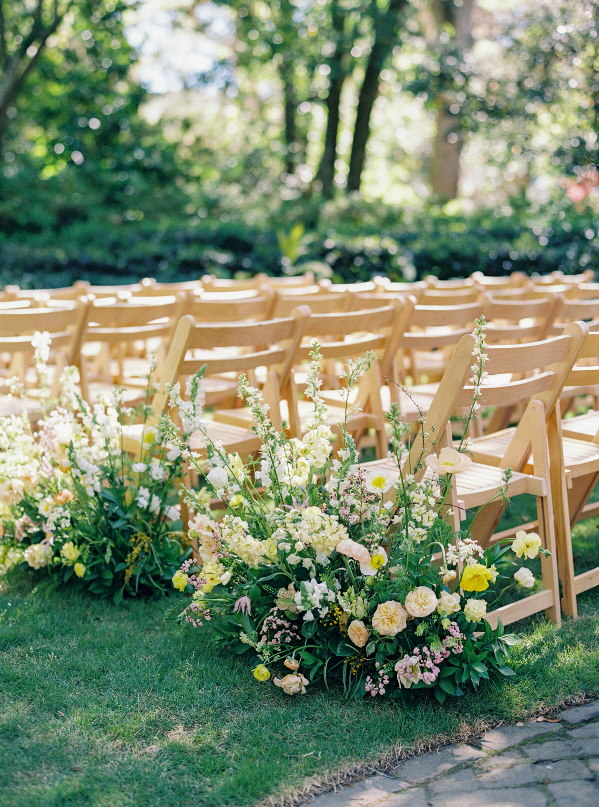 thomas bennett House wedding reception chairs and aisle flowers. Charleston destination wedding.