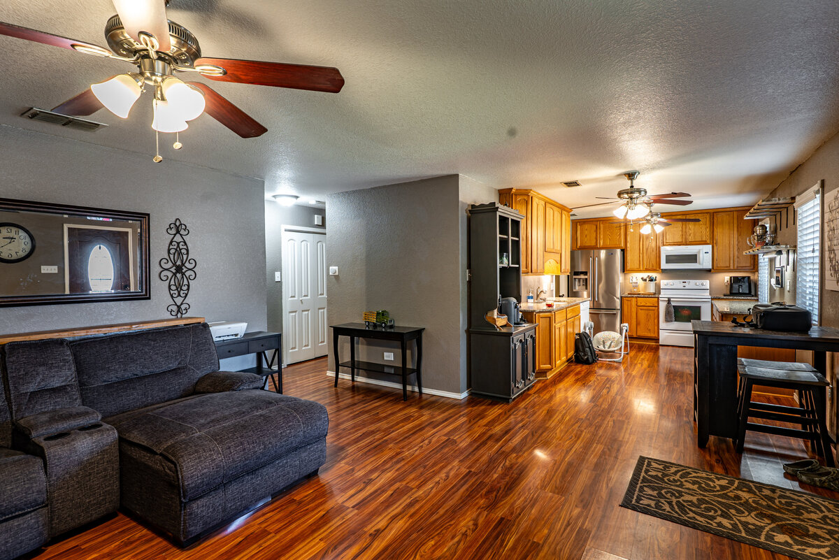 kitchen with granite countertops and under cabinet lighting