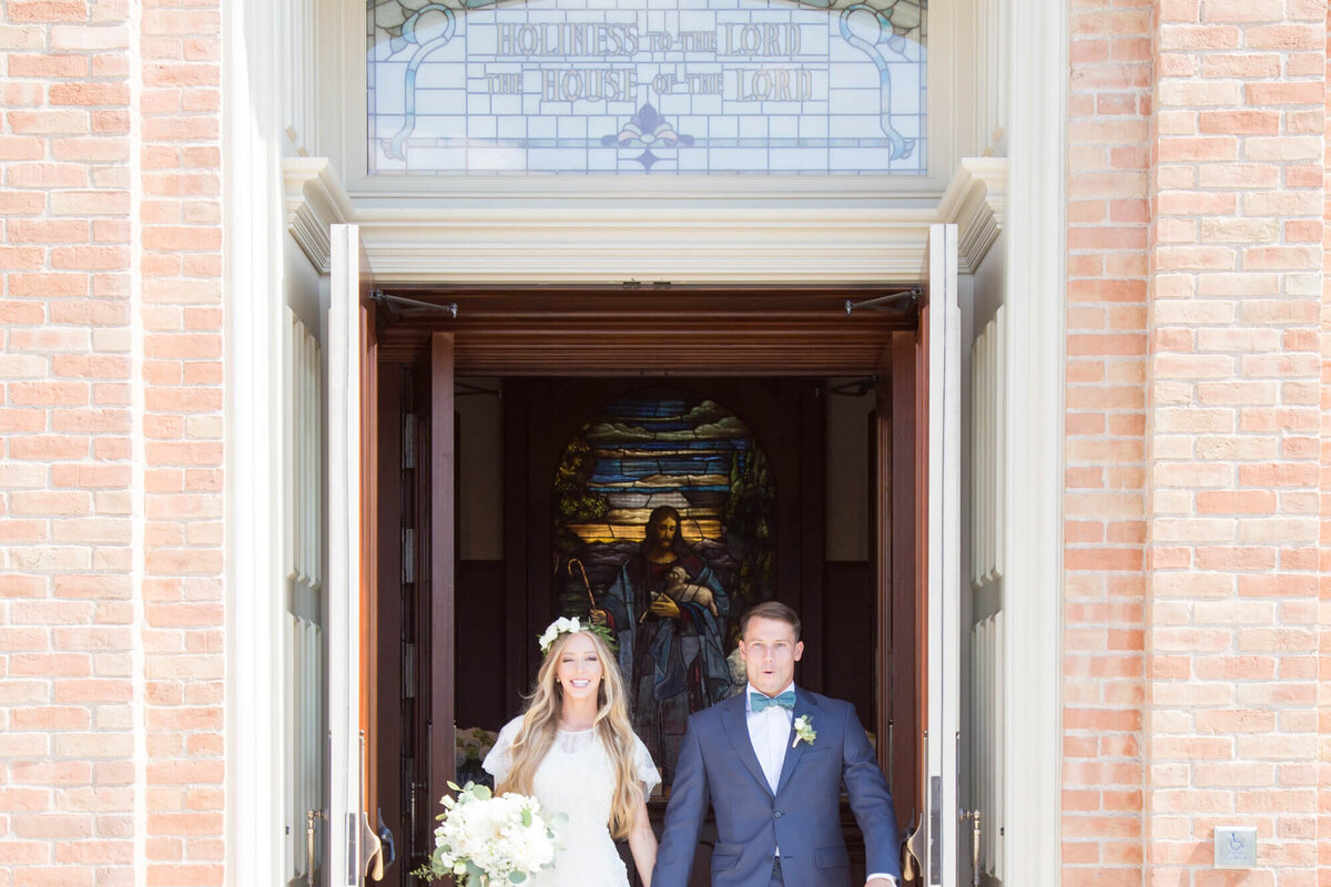 A wedding couple exiting the provo city center lds temple