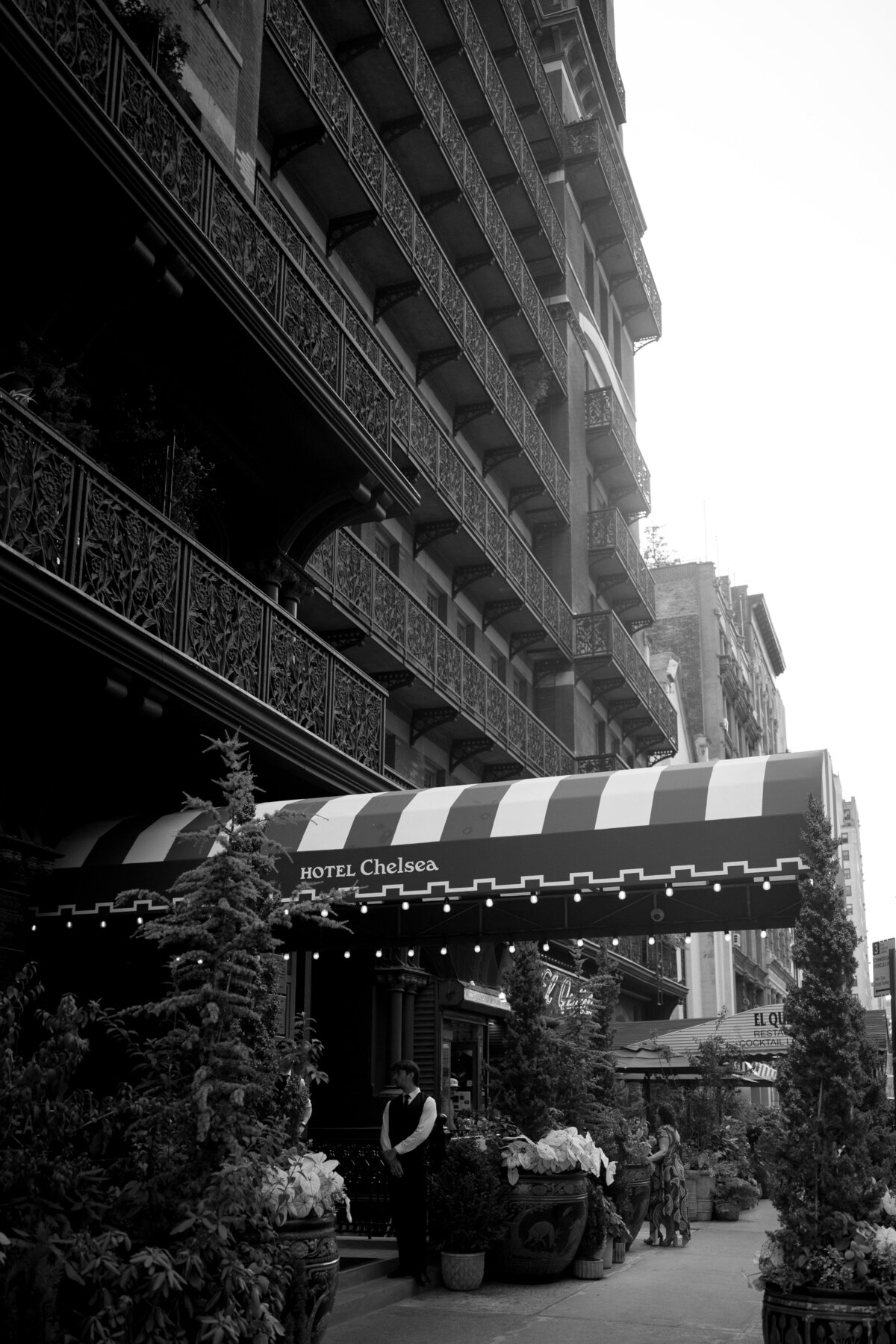 Black and white photo of the iconic Hotel Chelsea entrance in New York City, a historic venue for stylish weddings and intimate elopements, photographed by NYC wedding photographer Perry Hancock.