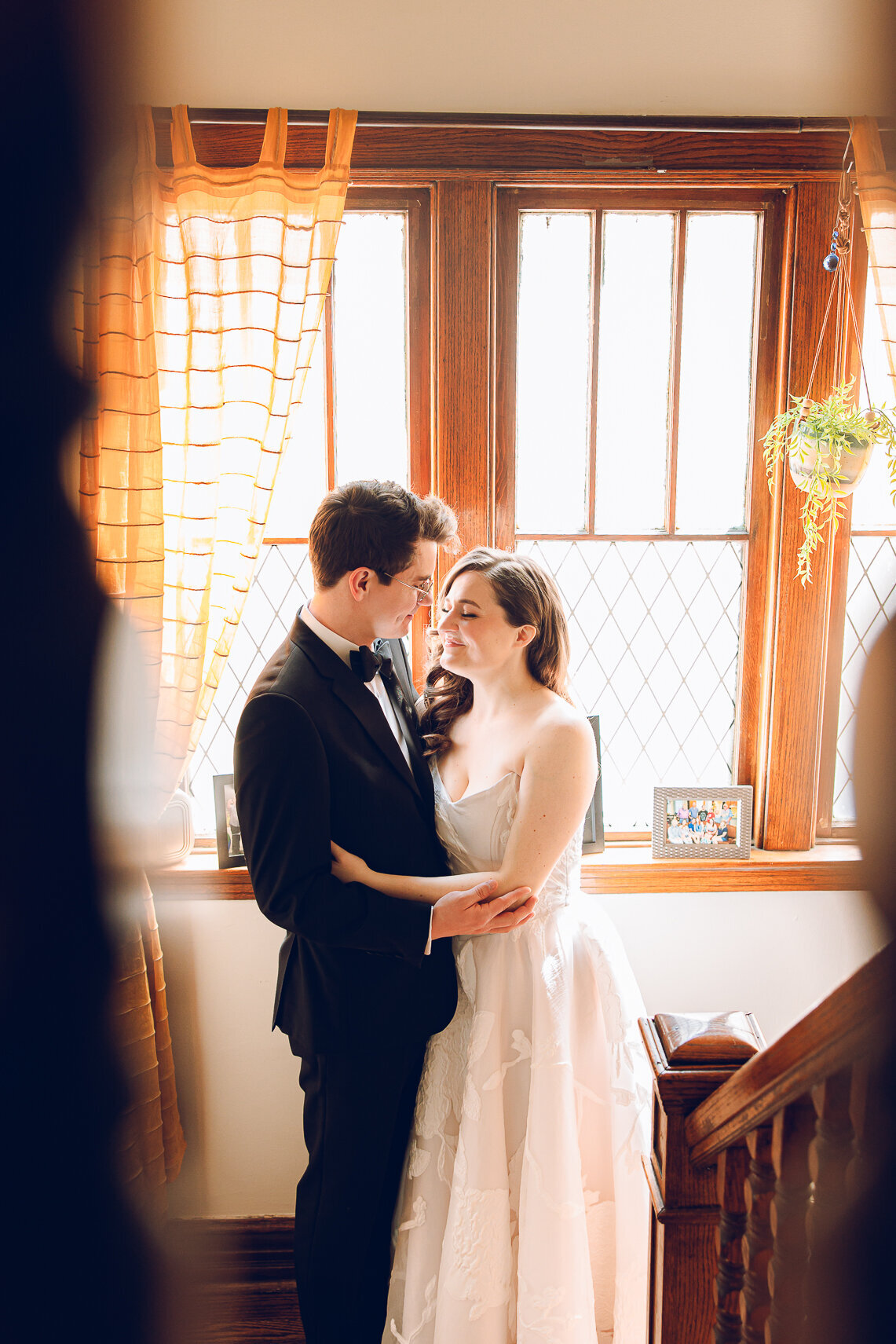 A couple gets ready at their home before their wedding at the Garfield Park Conservatory