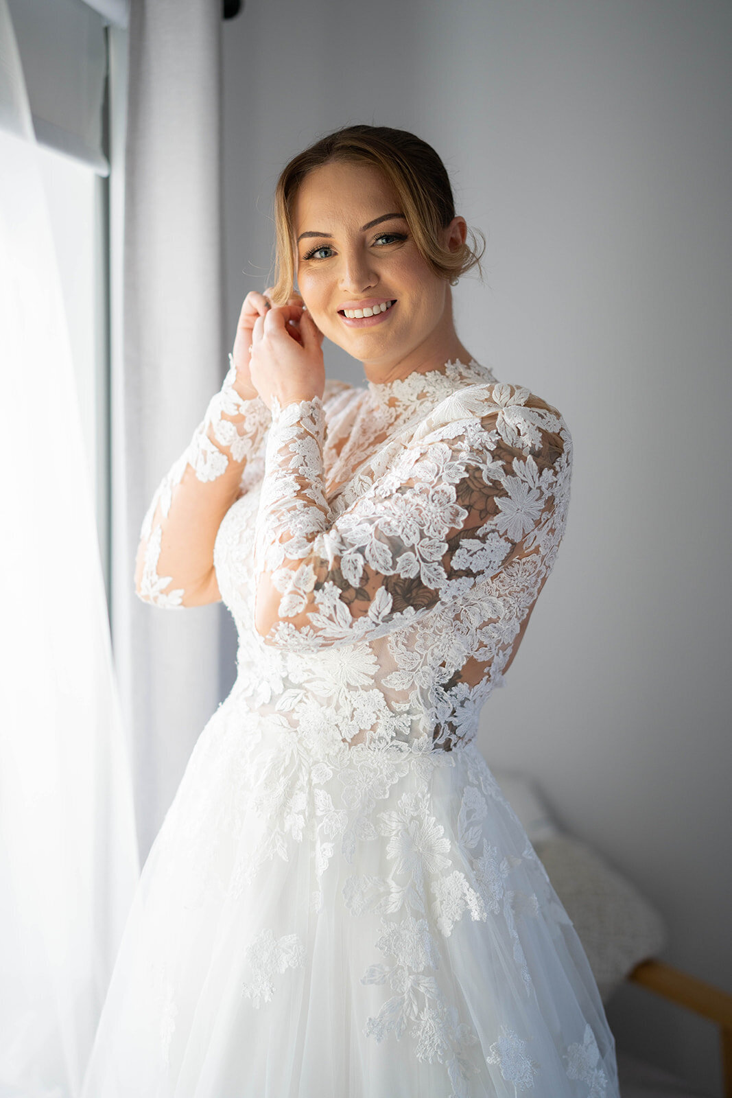 Candid moment of the bride getting ready