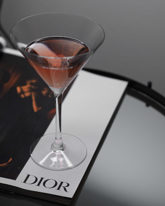 martini sitting on a Dior magazine