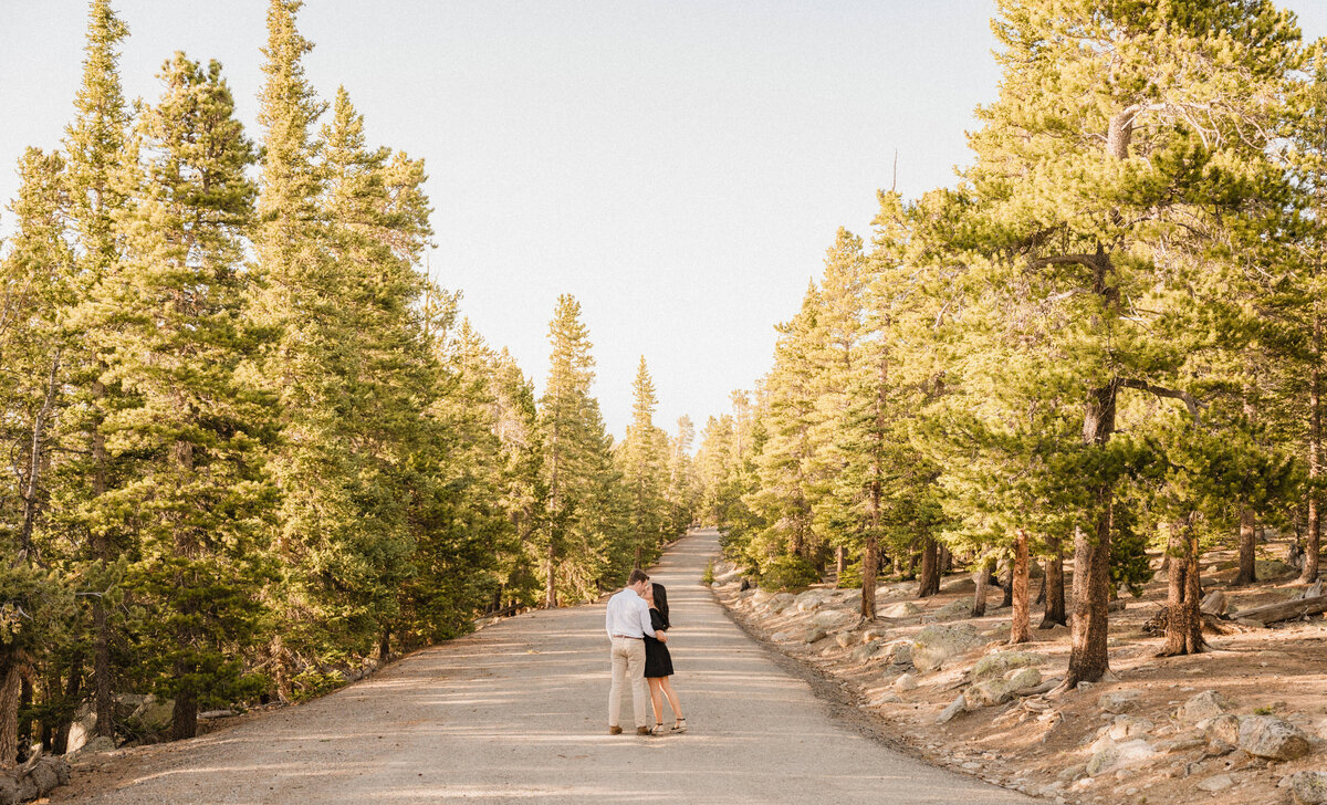 Couple embracing in a tunnel of trees