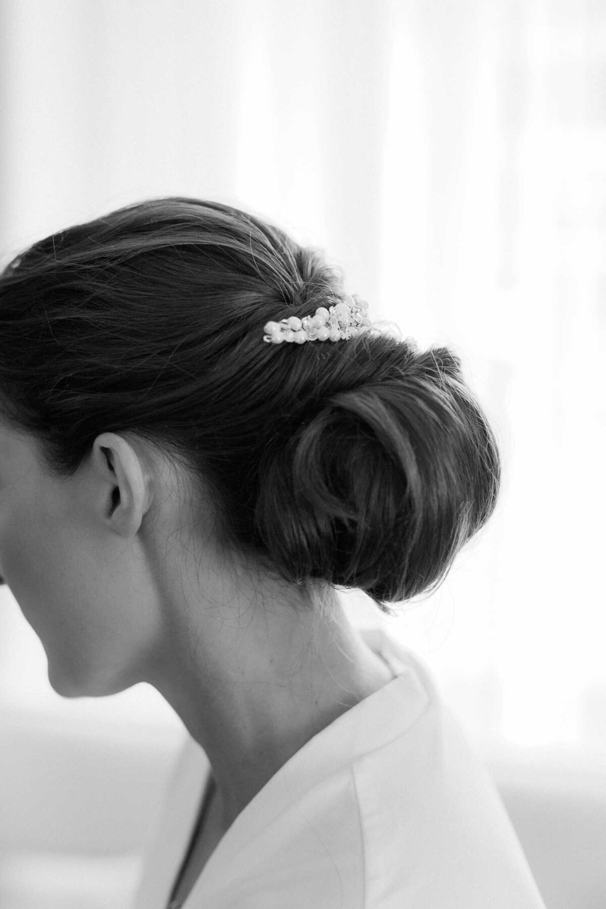 Chic Wedding Day Hair Chignon with pearl hair clip at Luxury Chicago Outdoor Historic Wedding Venue