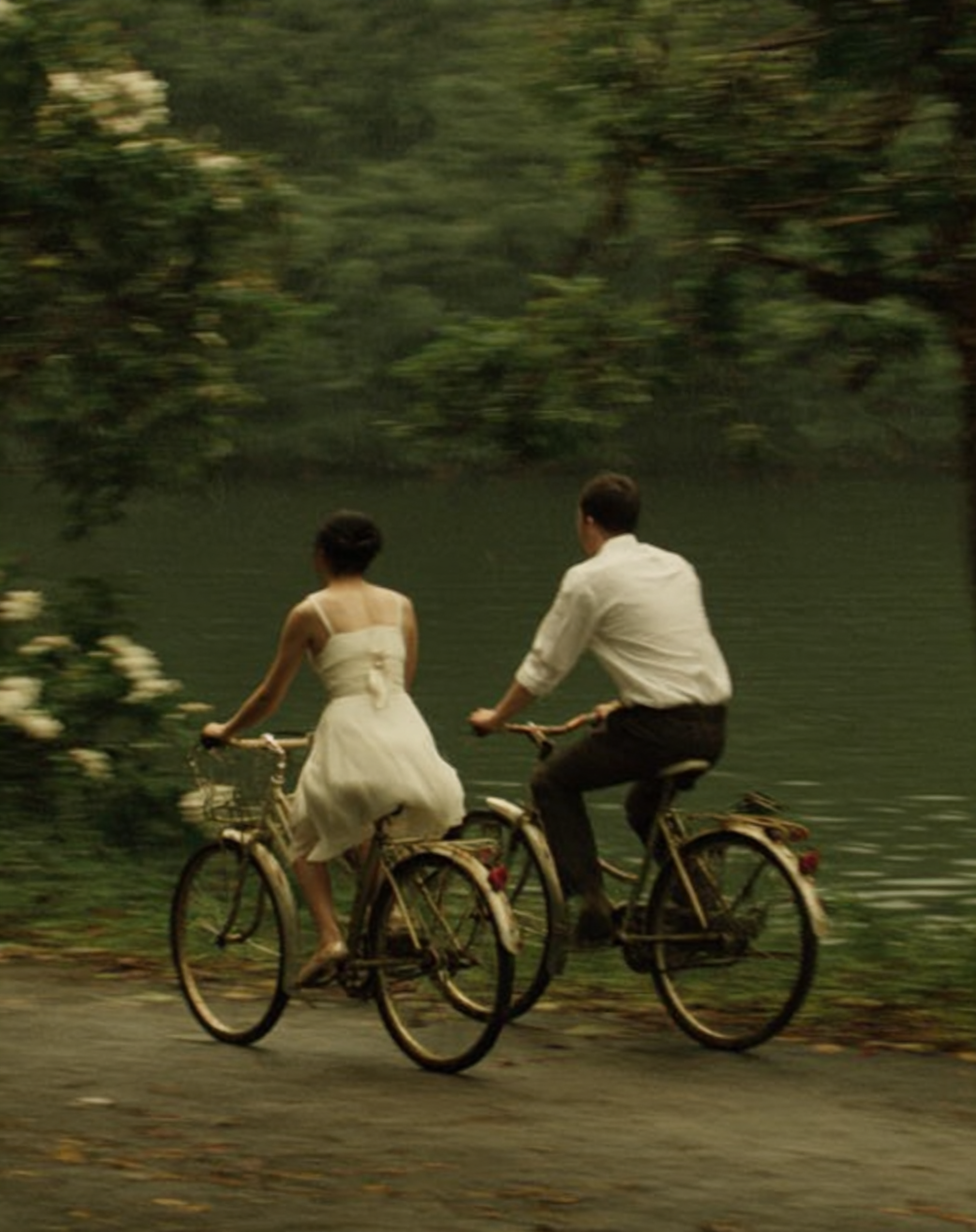 u8487914977_a_man_and_woman_in_white_dresses_ride_bicycles_al_f5e75640-9e19-467c-b412-fbcfb843137f_1