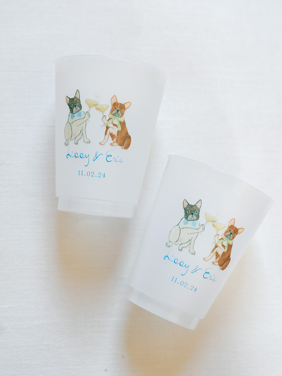 drink cups with drawings of the two dogs